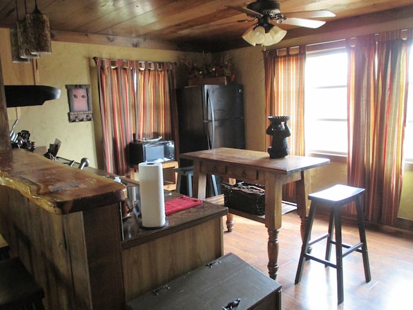 Kitchen has full size refrigerator, range, oven, dishwasher and microwave.