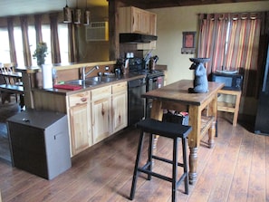 Kitchen has full size refrigerator, microwave, range, oven and dishwasher.