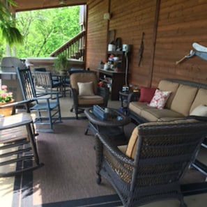 Covered Hot Tub Area with Gas Grill, Seating and Dining Areas