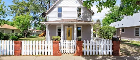 Updated Victorian home with deck, grill, and play area.