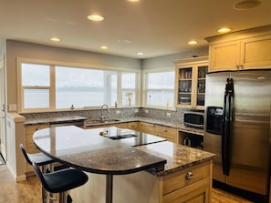 Modern kitchen with view of the Puget Sound.