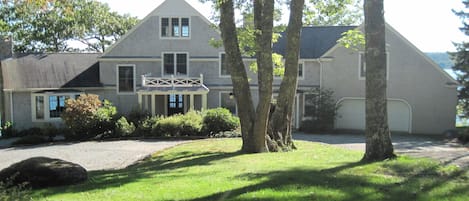 A graceful entrance to a lovely house sitting by the shore of Blue Hill Bay.