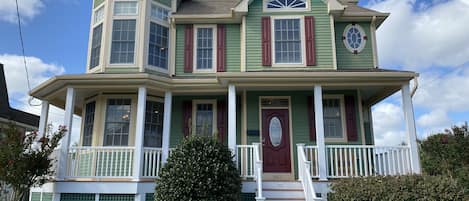 Modern Victorian home is spacious & meticulous! Front porch with rocking chairs.