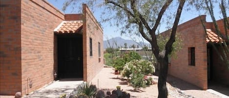 Front of Casita with mountains in background!! and side access to back patio!!