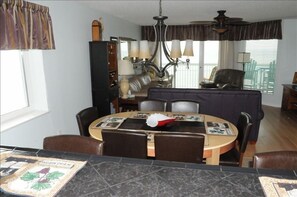 A view from the kitchen that looks out over the living area right to the sea.