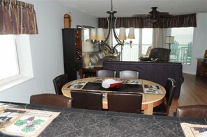 A view from the kitchen that looks out over the living area right to the sea.