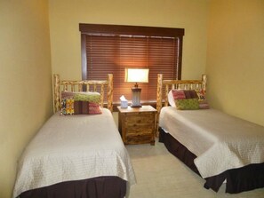 Twin beds in third bedroom