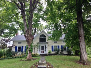 The front of the house in summer.