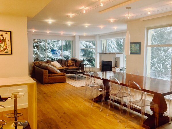 Spacious living room with views of the ski slope