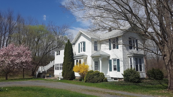House in springtime - Apt. stairs on the left towards the back of the house 