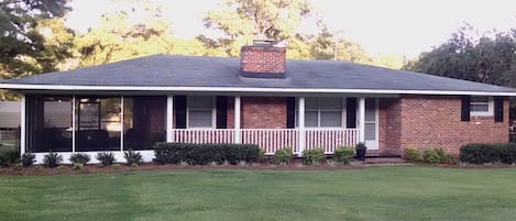 Newly added screened in porch with dining table for 6 and seating area