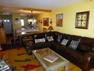 Familyroom with dinning area and kitchen in background