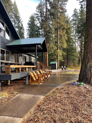 River viewing section with Adirondack chairs and tables for 10 persons.