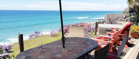 Up on deck, patio below beyond with hot tub