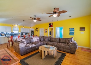 Living area with comfy sectional and amazing window views of Rollover Bay.