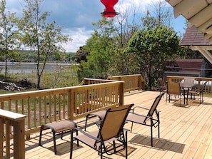 The deck comes with a dining area and a relaxing area