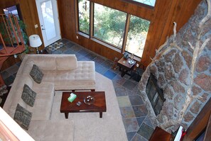 Downward view of living room from 2nd story game room.