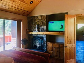 Master suite complete with smart TV, fireplace and deck access
