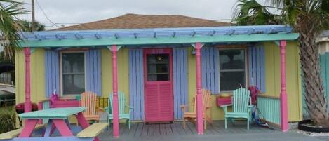 Cute and colorful cottage with large deck and outdoor shower (right).