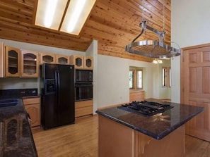 Kitchen and view into dining room.