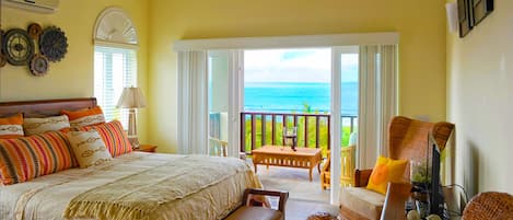 The main bedroom has a king-size bed and great views of Shoal Bay.