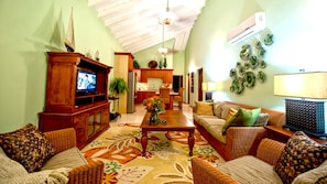 The large comfortable living area has a stereo and flat screen with cable TV.