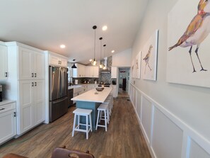 Bright spacious kitchen with plenty of seating. 