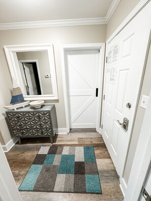 Entry way / hallway. Barn door leads to bunk room.