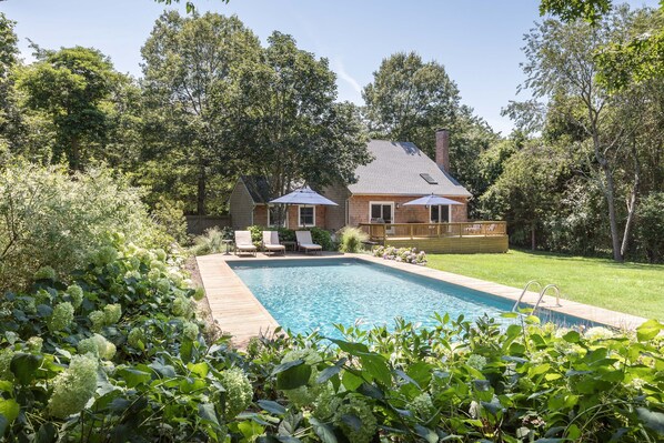 Sunny salt water pool and gardens