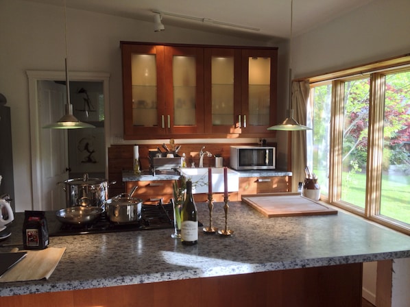 Our well equipped sun filled kitchen with granite island/oven is a delight! 