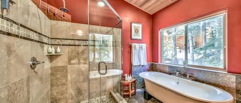 This ensuite master bathroom is truly spa-worthy with a dual vanity, large walk in shower, and clawfoot soaking tub