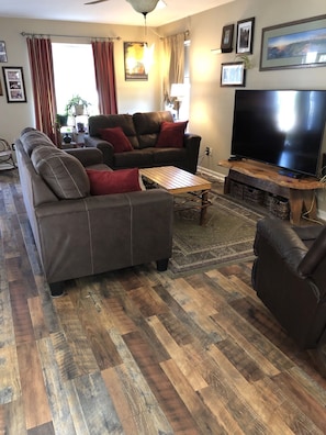 New wood floors make for a comfy living room.  