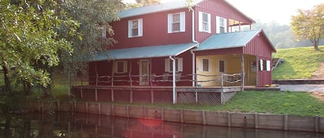 View of Cottage and small pond at lower level