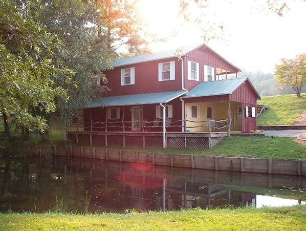 View of Cottage and small pond at lower level