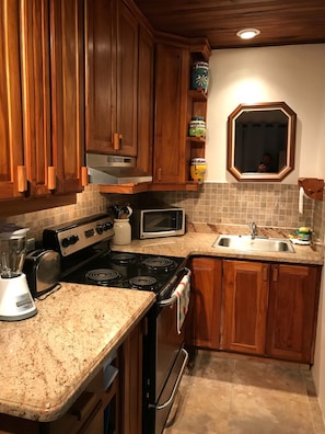 The kitchen is very well stocked for a rental.   Teak cabinetry was made nearby