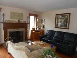 Living room area in the open floor plan to watch TV....