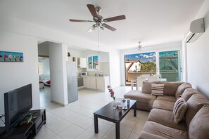 Modern open-plan living room, kitchen and dining area