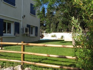 Garden with pool in background