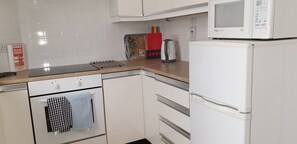 Putney kitchen with oven, hob, microwave, fridge freezer, kettle