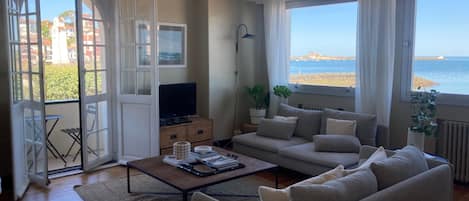 Living room with sea view and port view and balcony