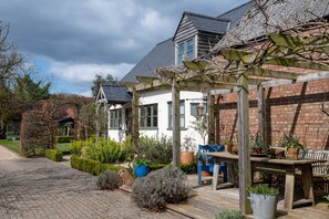 Pergola and cottage