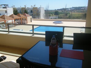 Large south-facing balcony overlooking the pool