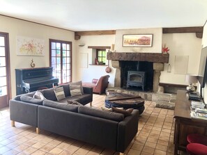 Living area with corner sofa and large screen TV