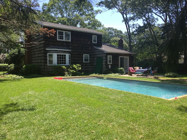 Backyard includes heated pool, gas grill and fire pit!