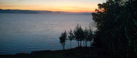 Twilight looking southeast from the deck, great room, & all 4 lakeside bedrooms.