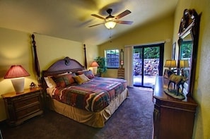 Master bedroom with King Bed and entry to private patio area