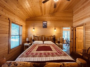 Bedroom 1 with attached bathroom and Sunroom- Located on Main Level