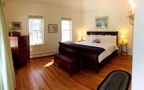 Primary bedroom, first floor, King bed with attached bathroom and porch.