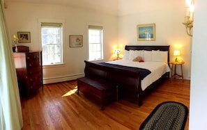 Primary bedroom, first floor, King bed with attached bathroom and porch.