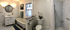 Primary bathroom ensuite, large curbless shower and soaking bathtub.